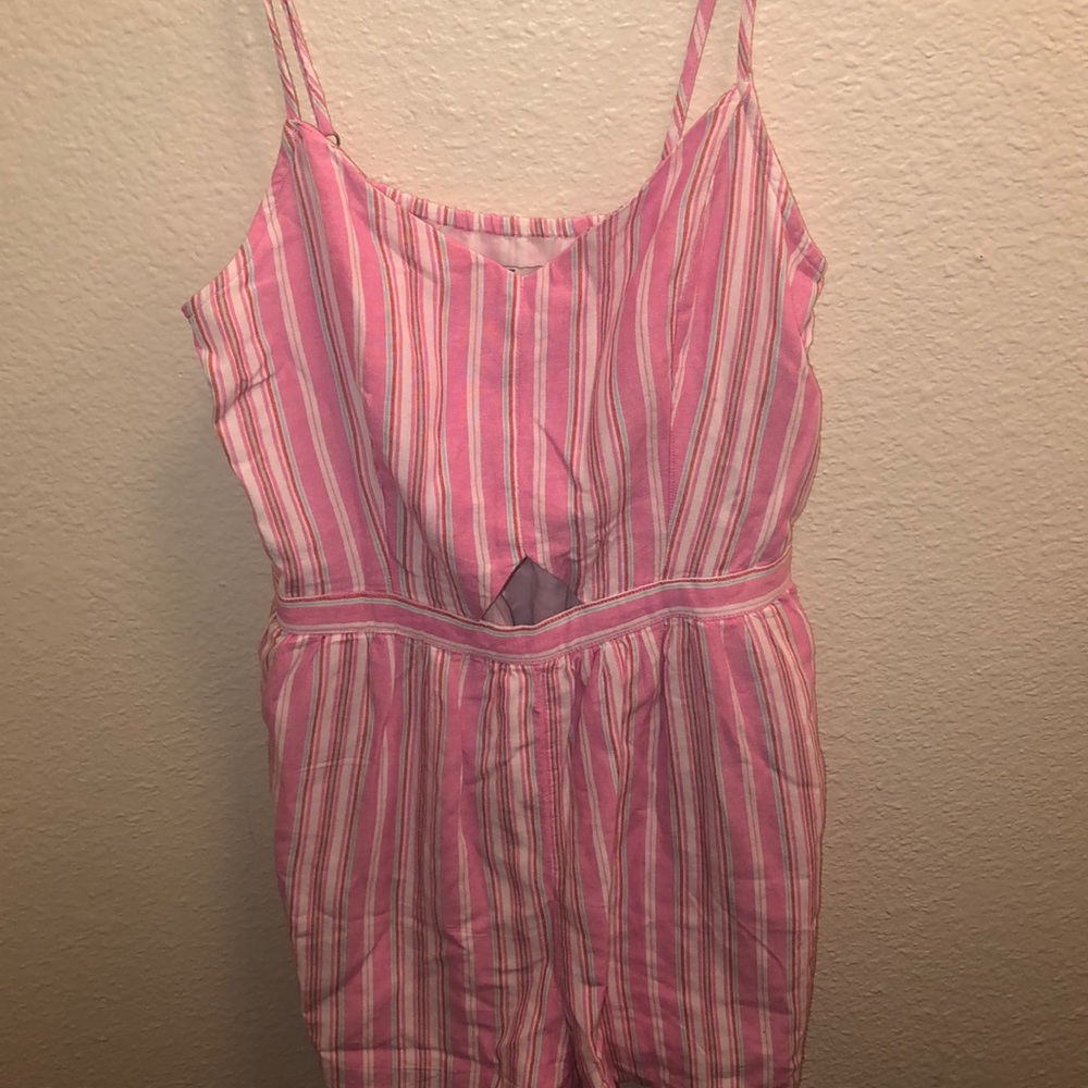 Pink romper with small opening on stomach area